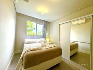 Ένα ή περισσότερα κρεβάτια σε δωμάτιο στο Live Residence Amplizi +29 φωτογραφίες