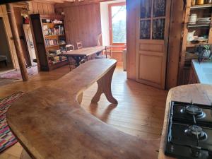 a wooden bench in the middle of a room at Terre Rouge in Boulc