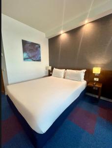 Posteľ alebo postele v izbe v ubytovaní GP Hotel