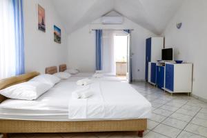 Postel nebo postele na pokoji v ubytování Apartments Djukic