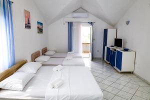 Postel nebo postele na pokoji v ubytování Apartments Djukic