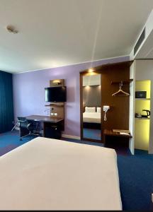 Posteľ alebo postele v izbe v ubytovaní GP Hotel
