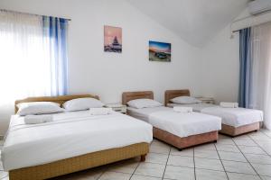 Postel nebo postele na pokoji v ubytování Apartments Djukic