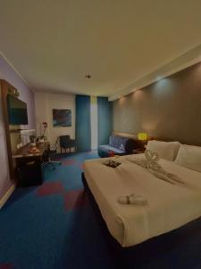 Posteľ alebo postele v izbe v ubytovaní GP Hotel