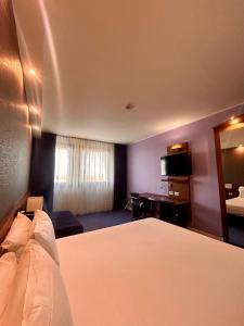 Posteľ alebo postele v izbe v ubytovaní GP Hotel