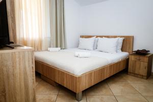 Postel nebo postele na pokoji v ubytování Apartments Djukic