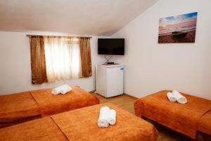 Postel nebo postele na pokoji v ubytování Apartments Djukic