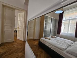 Postel nebo postele na pokoji v ubytování Slezska Apartments