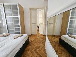 Postel nebo postele na pokoji v ubytování Slezska Apartments