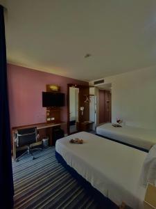 Posteľ alebo postele v izbe v ubytovaní GP Hotel