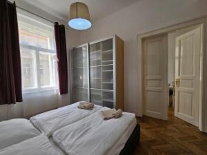 Postel nebo postele na pokoji v ubytování Slezska Apartments
