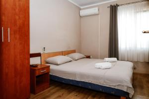 Postel nebo postele na pokoji v ubytování Apartments Djukic