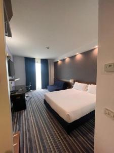 Posteľ alebo postele v izbe v ubytovaní GP Hotel