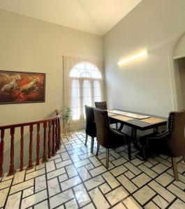 a dining room with a table and chairs at 3 BDR F10-1 Escape in Islamabad +11 photos