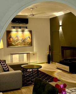 a living room with a couch and a table at 3 BDR F10-1 Escape in Islamabad