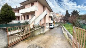 a house with a car parked in front of it at SE148 - Marotta, trilocale con terrazzo e posto auto in Marotta