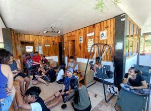 a group of people sitting in a room at Buscalan GL's Crib & Coffee in Tinglayan