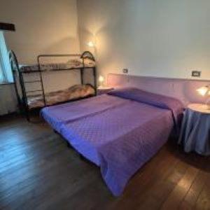 A bed or beds in a room at Il Pianetto Holiday Accomodation