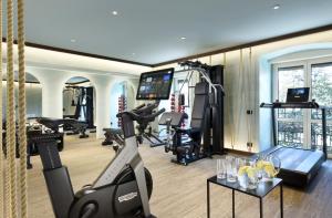 a gym with treadmills ellipticals and a treadmill at Grand Hotel Savoia in Genoa