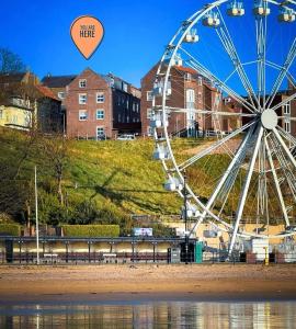 a ferris wheel with a heart in the sky at The Distillery Room in Scarborough
