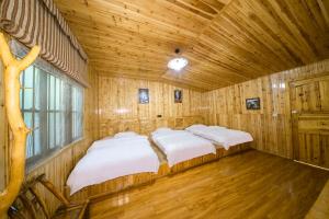 Кровать или кровати в номере Xiangzixi Bed and Breakfast