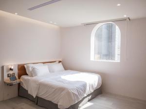 Katil atau katil-katil dalam bilik di LIVIN Hotel
