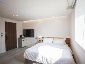 Katil atau katil-katil dalam bilik di LIVIN Hotel