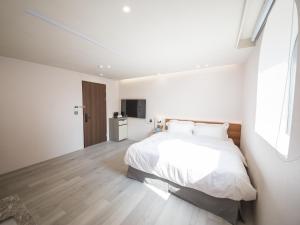 Katil atau katil-katil dalam bilik di LIVIN Hotel