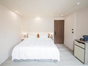 Katil atau katil-katil dalam bilik di LIVIN Hotel