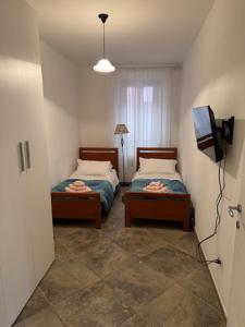 Postel nebo postele na pokoji v ubytování Albergo Ristorante Cavallo Bianco