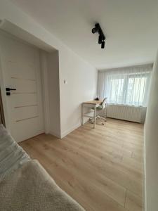 Łóżko lub łóżka w pokoju w obiekcie Łabędź Jastarnia