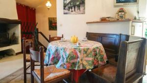 a dining room with a table with a pumpkin on it at Villa jean-marie in Sengouagnet