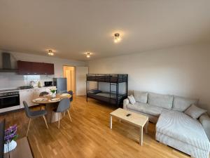 a living room with a couch and a table at Home2Cologne in Kerpen