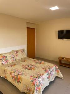 Ένα ή περισσότερα κρεβάτια σε δωμάτιο στο Caminho de Itacoatiara