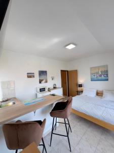 Postel nebo postele na pokoji v ubytování Rooms & Apartments Hegic