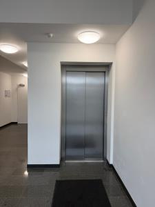 a hallway with a door in a building at Home2Cologne in Kerpen