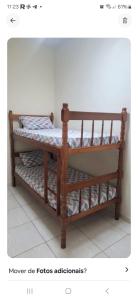 a wooden bunk bed in a room at Apartamento da Rosi in Resende