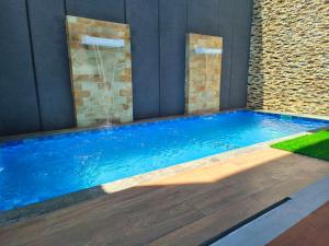 a swimming pool in a house with at Villa Srikandi Caldera D5 in Tlekung