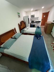 Postel nebo postele na pokoji v ubytování Residencial 101 Ilha Grande
