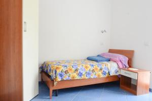 Postel nebo postele na pokoji v ubytování Appartamenti Le Giare Acciaroli