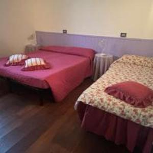 A bed or beds in a room at Il Pianetto Holiday Accomodation