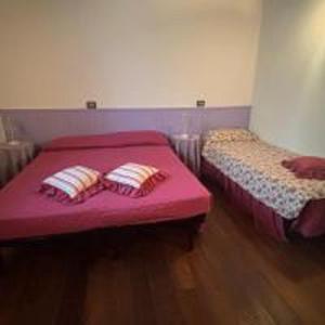 A bed or beds in a room at Il Pianetto Holiday Accomodation