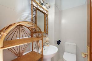 a bathroom with a toilet and a mirror at Gigantes Apartament Sea View in Acantilado de los Gigantes +19 photos