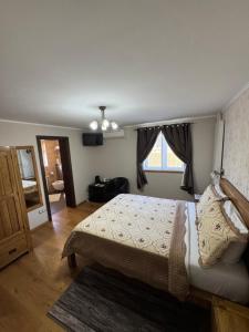 Postel nebo postele na pokoji v ubytování B&B Millenium House