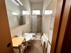 a bathroom with a sink and a shower and a toilet at SuiteSigismondo-L'appartamento Più Centrale Di Rimini in Rimini +13 photos