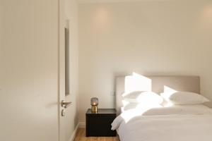 Ένα ή περισσότερα κρεβάτια σε δωμάτιο στο Agua Doce Suites