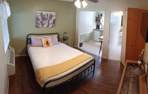 a bedroom with a large bed in a room at Trees Motel in Bishop