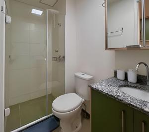 a bathroom with a toilet and a shower and a sink at Atmosfera Hachi 416I Luz Natural & Conexão Elevada in Sao Paulo +23 photos