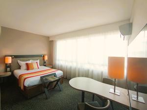 Postel nebo postele na pokoji v ubytování Mercure Limoges Centre