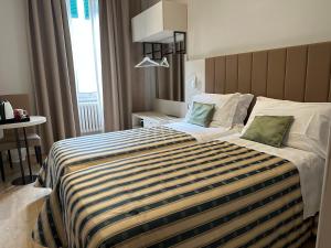 Postel nebo postele na pokoji v ubytování Hotel Giappone